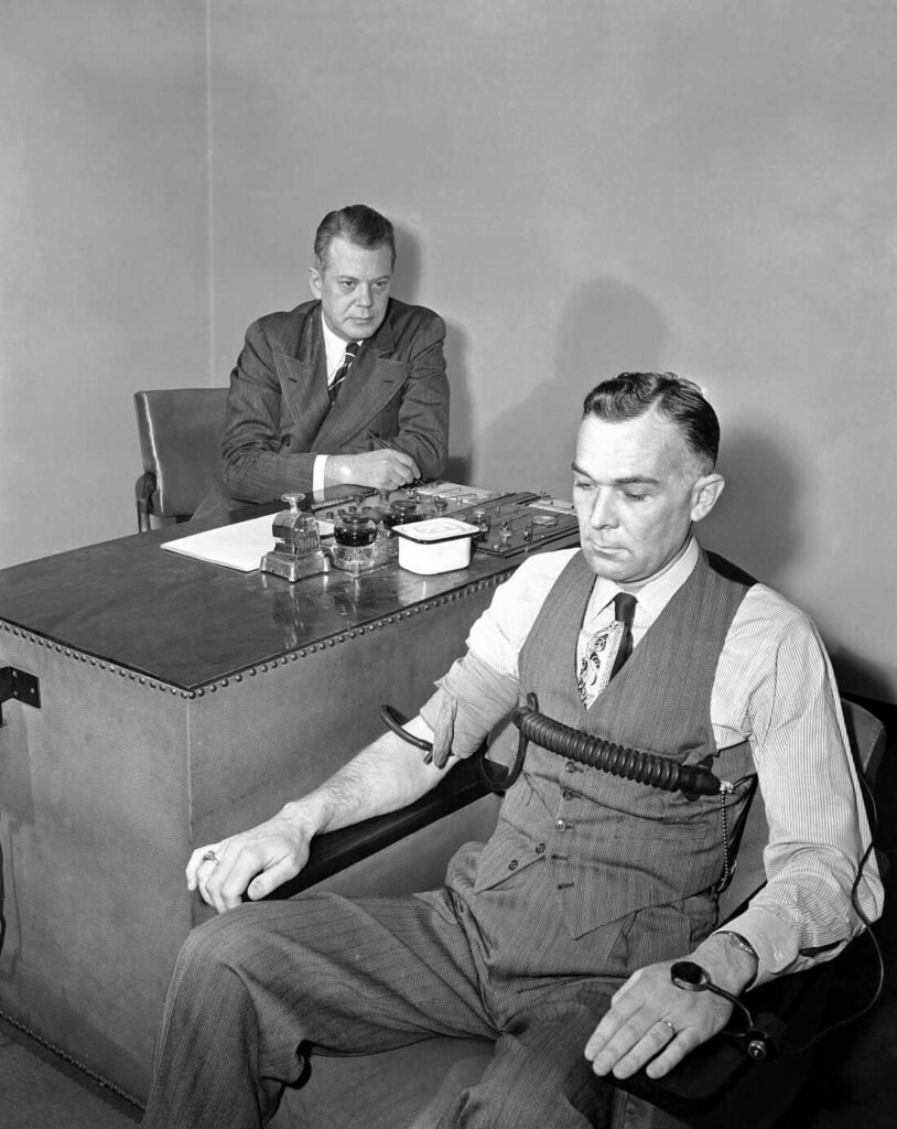 Leonarde Keeler demonstrating how lie detectors work during an early polygraph test, 1948